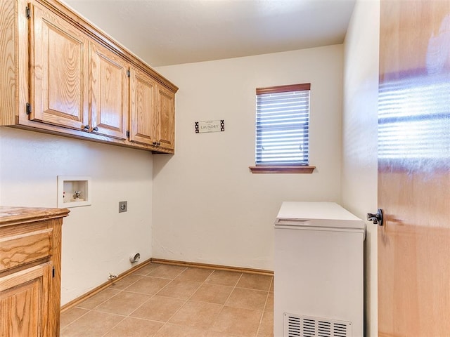 laundry area with hookup for a washing machine, cabinets, and hookup for an electric dryer