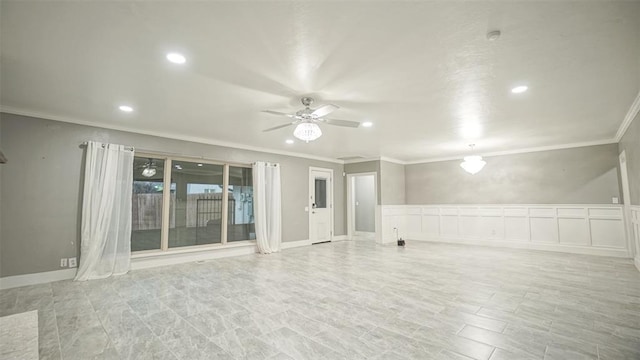 unfurnished room featuring ceiling fan and ornamental molding