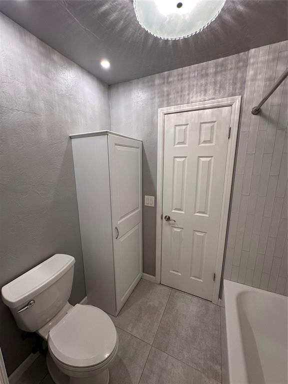 bathroom with tile patterned flooring, separate shower and tub, and toilet