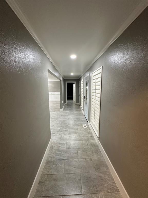 corridor with crown molding