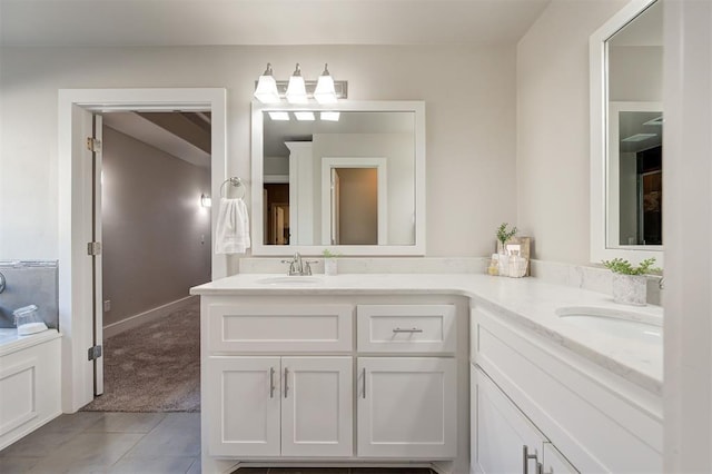 bathroom with tile patterned floors and vanity