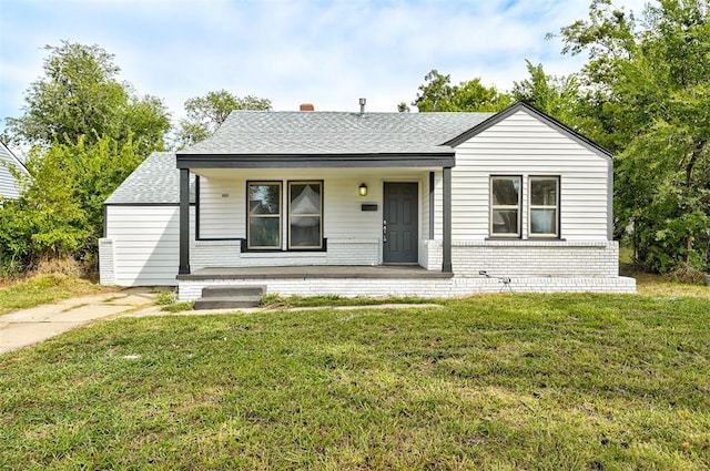 view of front of home featuring a front lawn and a porch