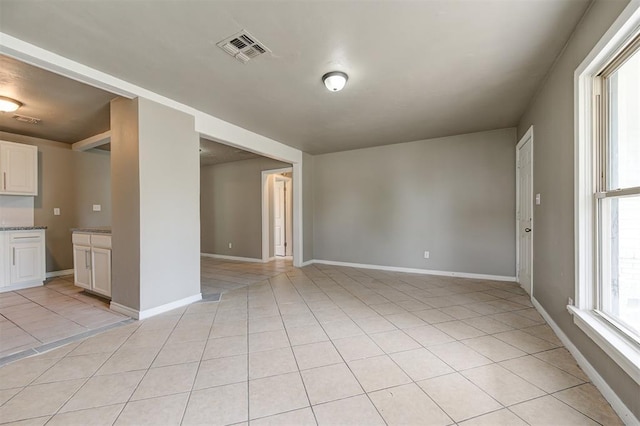 empty room with light tile patterned flooring