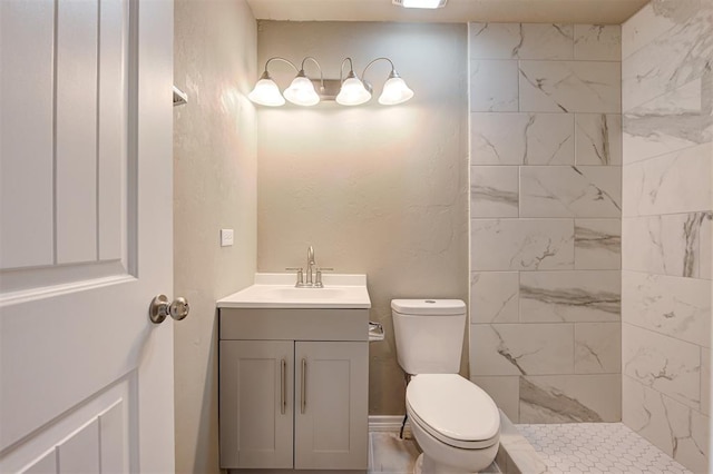 bathroom featuring vanity, toilet, and a tile shower