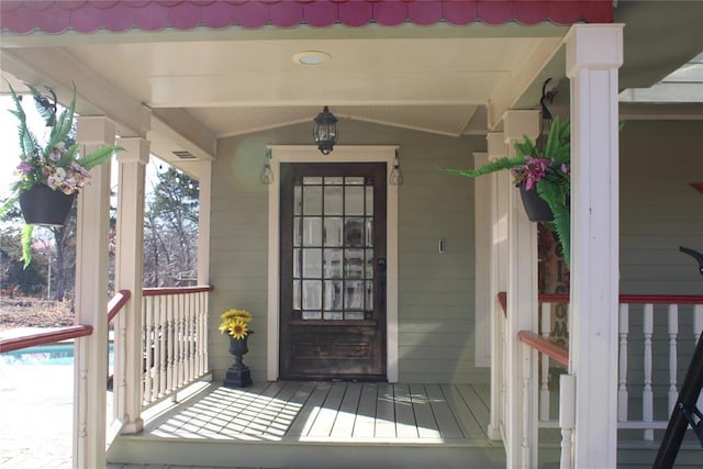 property entrance with covered porch