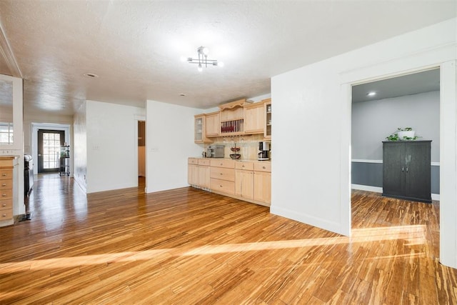 kitchen featuring light brown cabinetry and light wood-type flooring