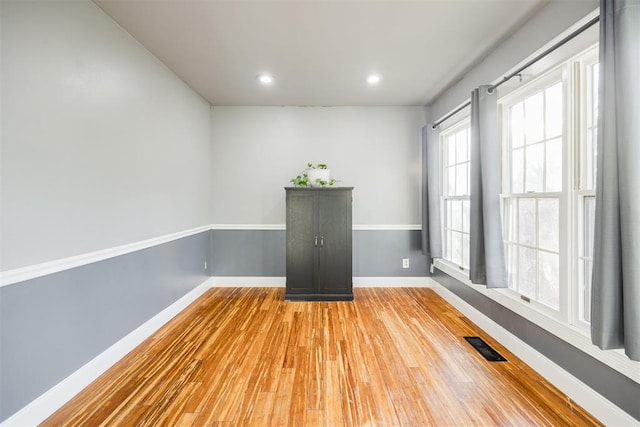 unfurnished room featuring hardwood / wood-style floors