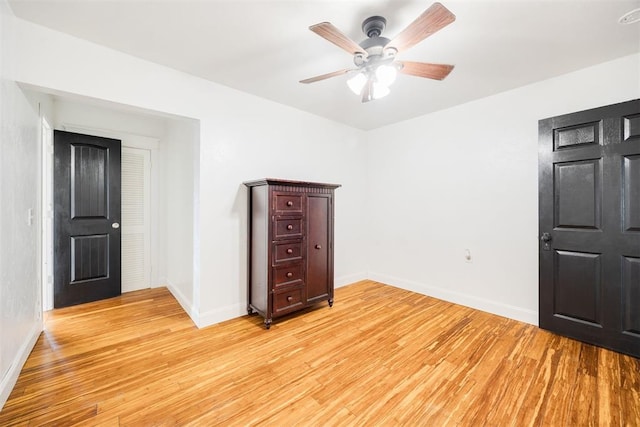 unfurnished room featuring ceiling fan and light wood-type flooring