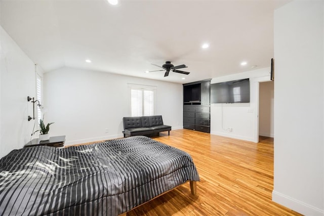 bedroom with hardwood / wood-style flooring, lofted ceiling, and ceiling fan