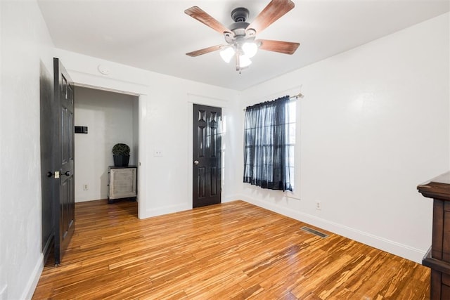 unfurnished bedroom featuring a closet, ceiling fan, and light hardwood / wood-style flooring