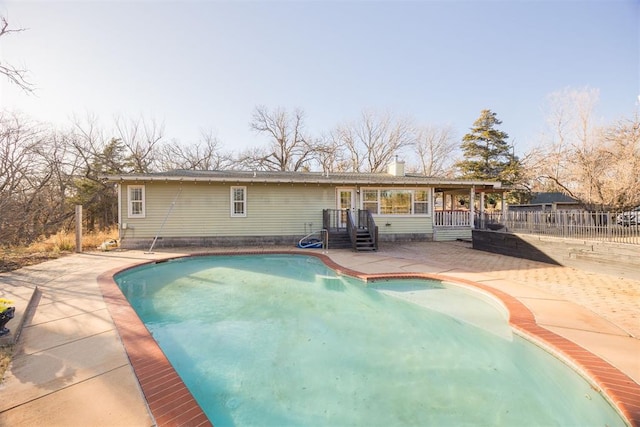 view of swimming pool featuring a patio area