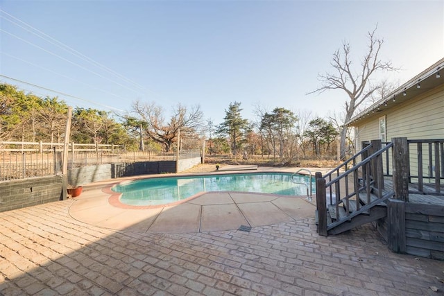 view of pool featuring a patio