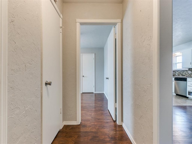 hallway featuring dark hardwood / wood-style floors