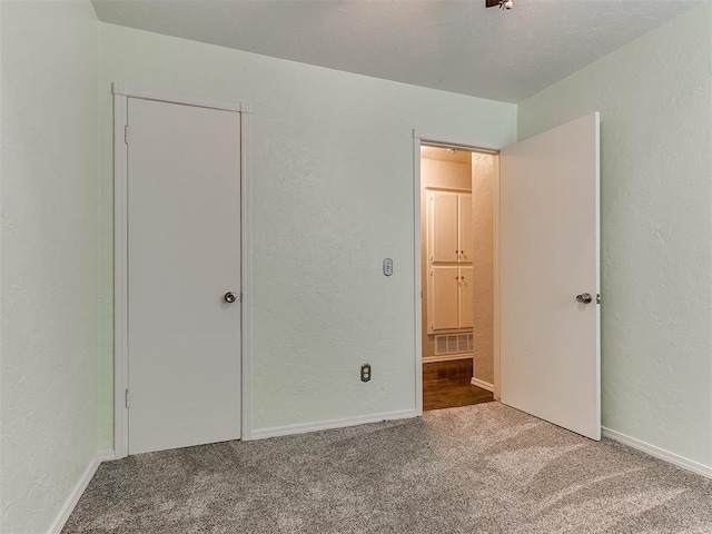 unfurnished bedroom with carpet