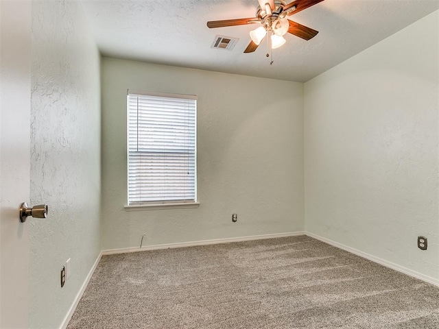 unfurnished room featuring carpet and ceiling fan