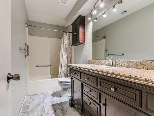 full bathroom featuring shower / bath combo with shower curtain, vanity, and toilet