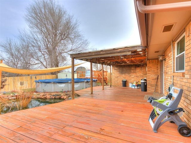 deck with a covered pool