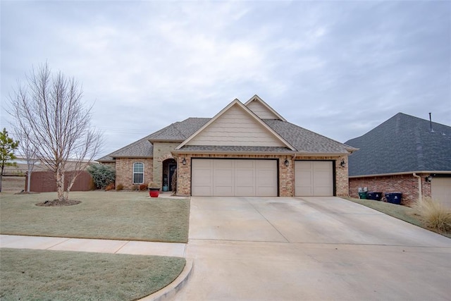 view of front of property featuring a garage and a front yard