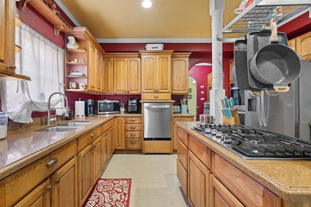 kitchen featuring crown molding, appliances with stainless steel finishes, and sink