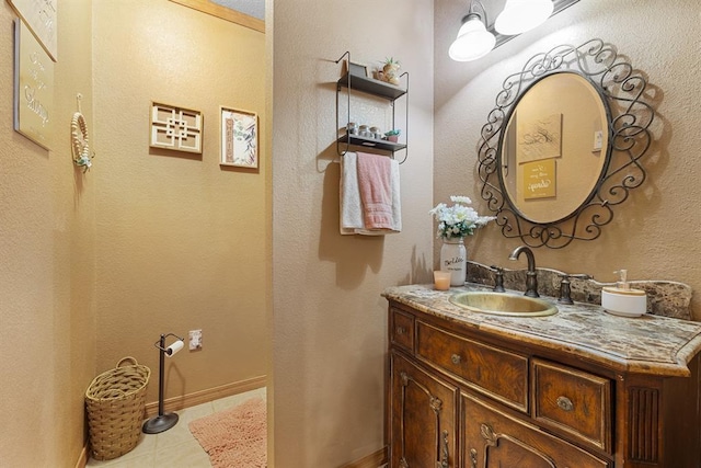 bathroom with tile patterned floors and vanity