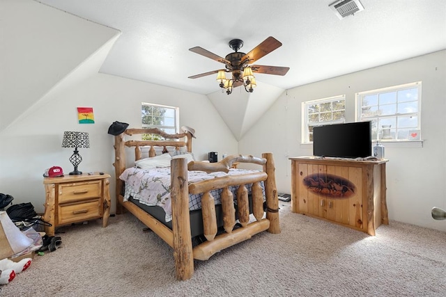 bedroom featuring light carpet, vaulted ceiling, and ceiling fan