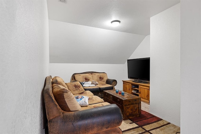 carpeted living room with vaulted ceiling