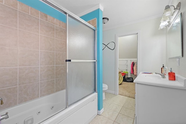 full bathroom featuring crown molding, vanity, toilet, and tile patterned flooring