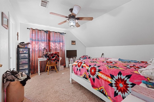 bedroom with ceiling fan, carpet floors, and vaulted ceiling