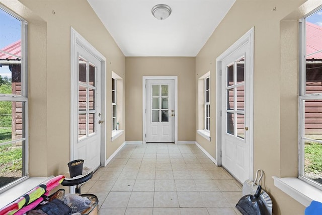 doorway featuring light tile patterned flooring