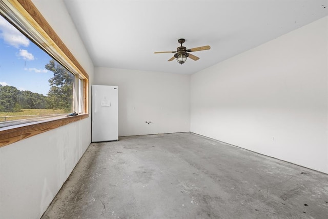 spare room with concrete flooring and ceiling fan