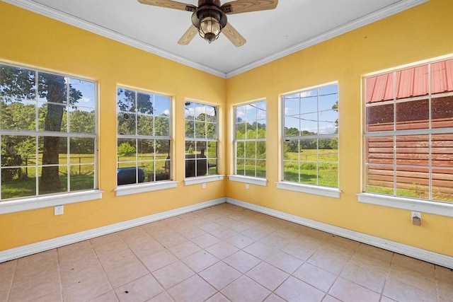 unfurnished sunroom featuring ceiling fan