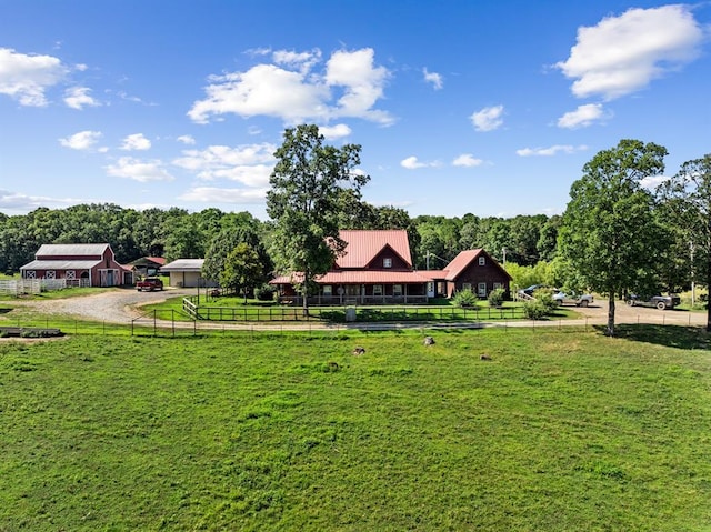 view of property's community featuring a yard and a rural view