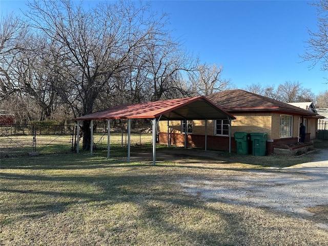 exterior space featuring a front yard and a carport