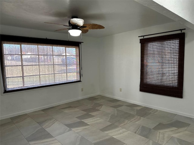 spare room with ceiling fan