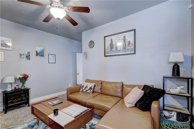 carpeted living room with ceiling fan