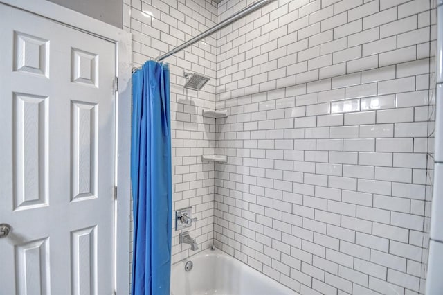 bathroom featuring shower / bath combination with curtain