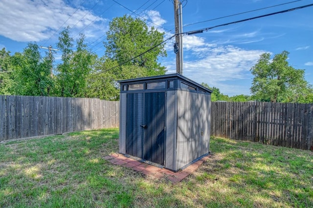 view of outbuilding featuring a lawn