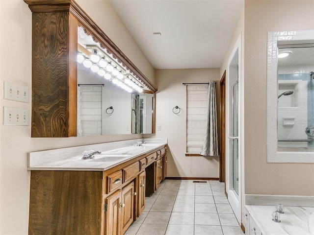 bathroom featuring tile patterned flooring, vanity, and separate shower and tub