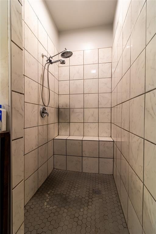 bathroom with tiled shower