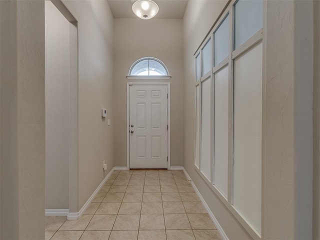 doorway to outside featuring light tile patterned floors