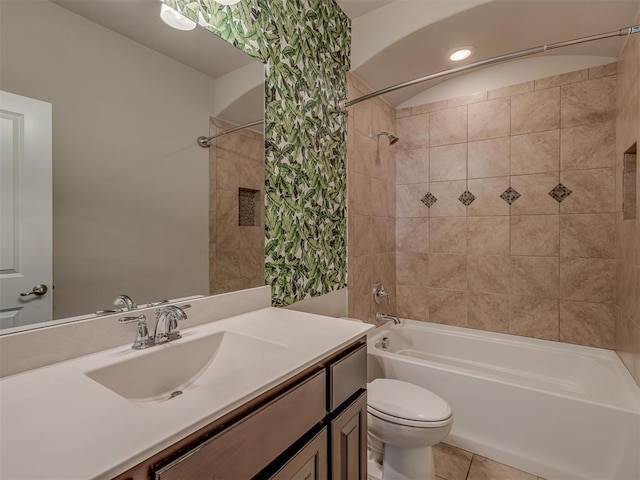 full bathroom featuring toilet, shower / tub combo, vanity, and tile patterned floors