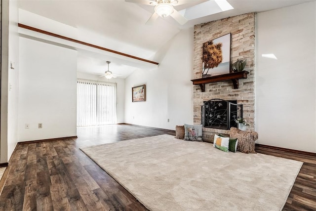 unfurnished living room featuring a fireplace, ceiling fan, dark hardwood / wood-style flooring, and vaulted ceiling