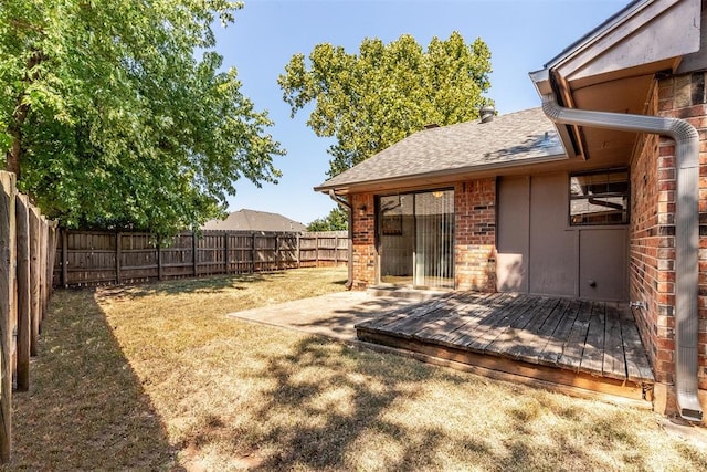 view of yard featuring a wooden deck