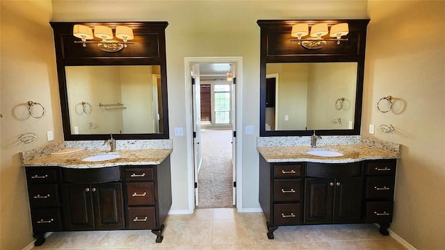 bathroom featuring tile patterned flooring and vanity