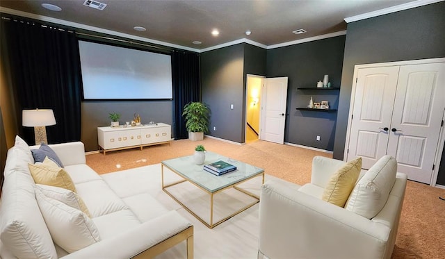 cinema room featuring carpet floors and crown molding