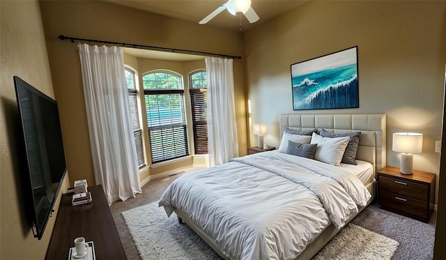 bedroom with dark carpet and ceiling fan