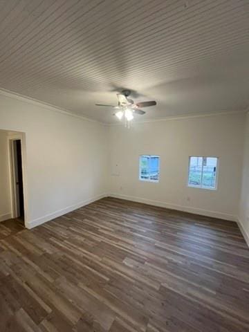 empty room with ceiling fan, dark hardwood / wood-style flooring, and crown molding