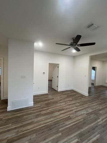 unfurnished room featuring ceiling fan and dark hardwood / wood-style flooring