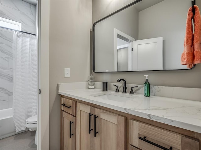 full bathroom featuring toilet, vanity, and shower / tub combo with curtain