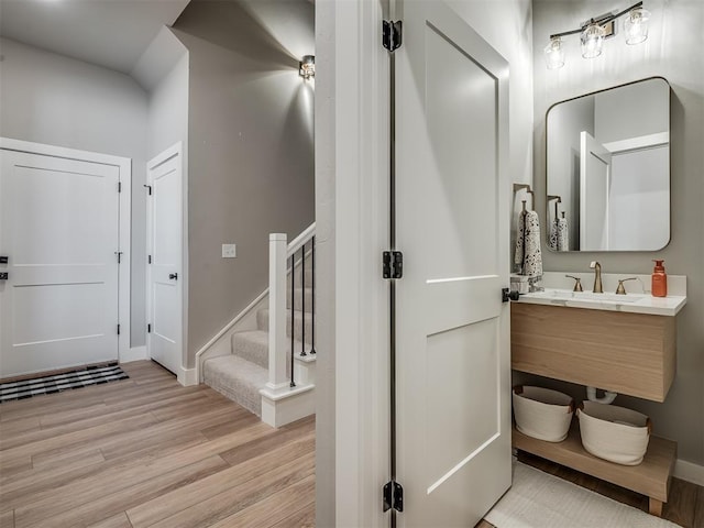 bathroom with hardwood / wood-style floors and vanity